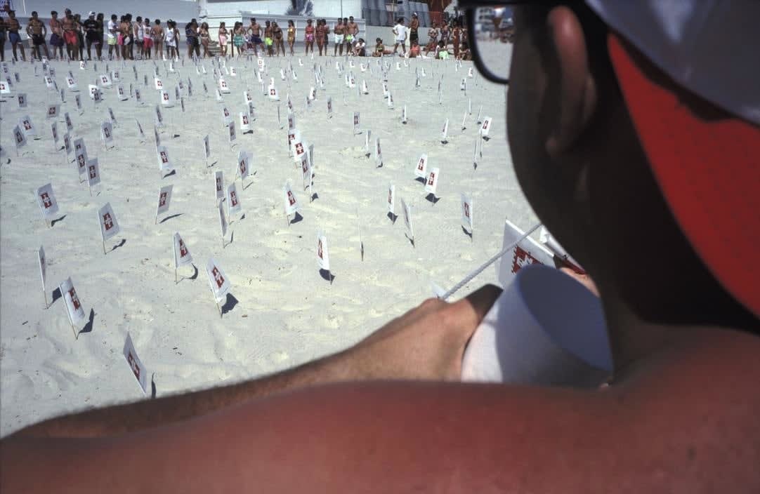 Alex Webb, Daytona Beach (red/white flags in beach sand), 1990