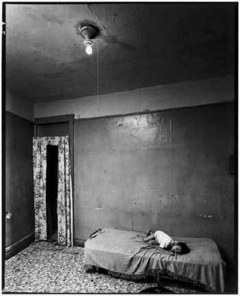 Bruce Davidson, Boy on Bed With Bare Light Bulb in Ceiling, 1966-68