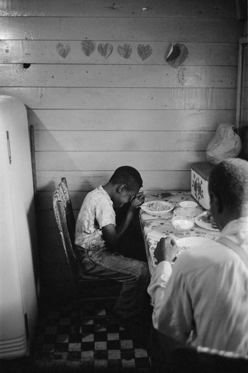 Constantine Manos, Island Boy, Daufuskie Island, South Carolina (boy praying at table), 1952