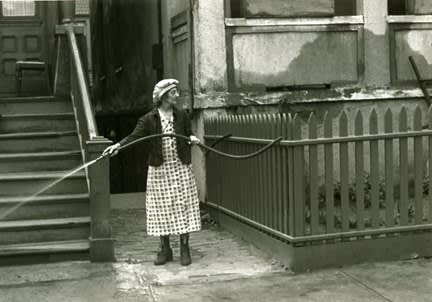 Helen Levitt, Untitled, New York (woman with hose), c. 1940
