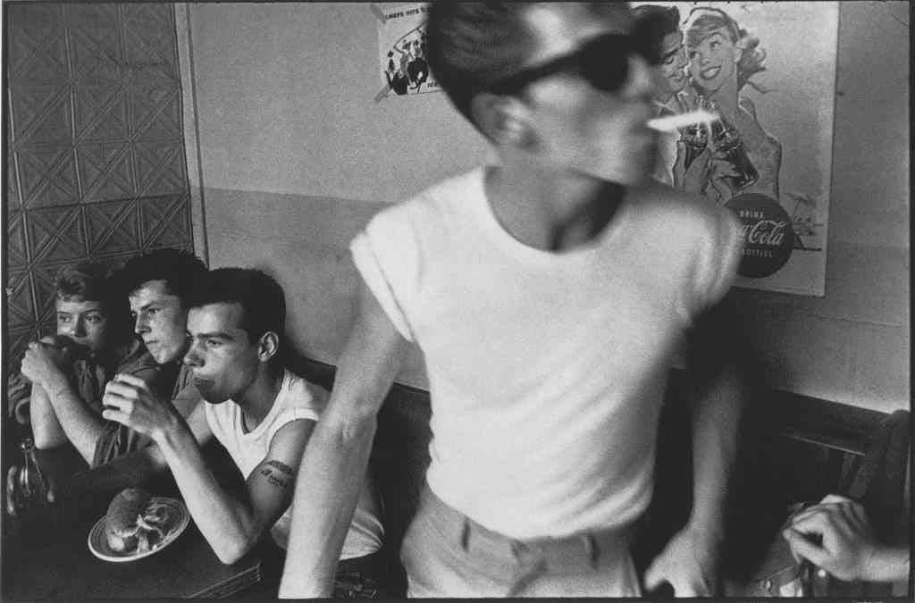 Bruce Davidson, Brooklyn Gang (boys sitting at table, one standing with cigarette), 1959