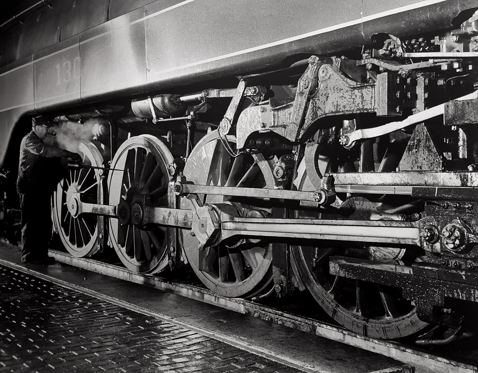 O. Winston Link, Howard Ruble, Engineer of Train No. 2, Lubricates a class K2, #130 (NW 21), Waynesboro, Virginia, c....
