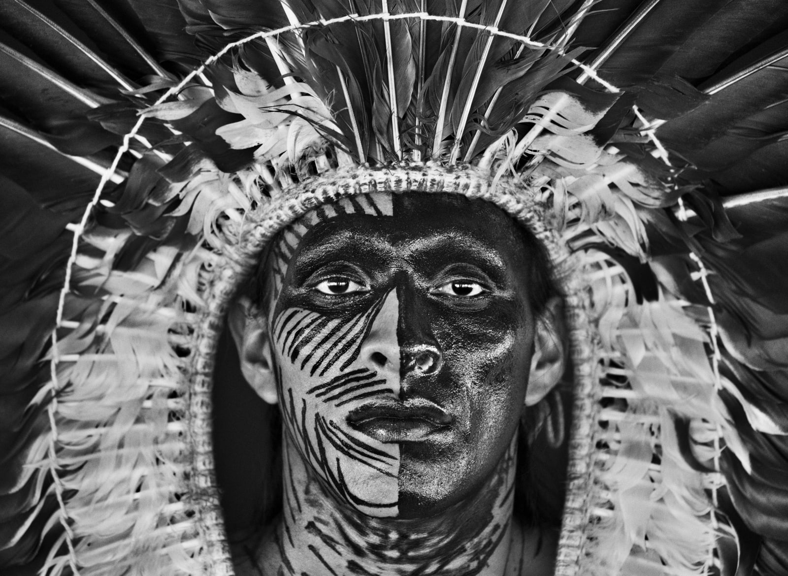 Sebastião Salgado, Adão Yawanawá in a headdress of eagle feathers, Village of Nova Esperança Rio Gregório Indigenous Territory, State of...