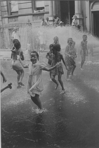 Helen Levitt, Children playing in water spraying from fire hydrant, NYC, c.1945