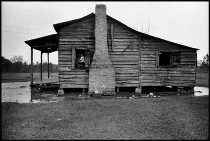Bruce Davidson, Felicia Blackman Holding Daughter, Felicia in Cabin Window. Trickum Forks, Alabama, 1965