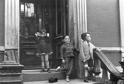 Helen Levitt, Kids in Masks on Stoop, 1942