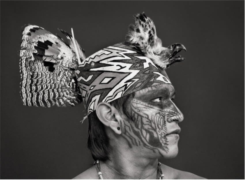 Sebastião Salgado, 241, Miró (Viná) Yawanawá, whose hat is decorated with the beak of an eagle