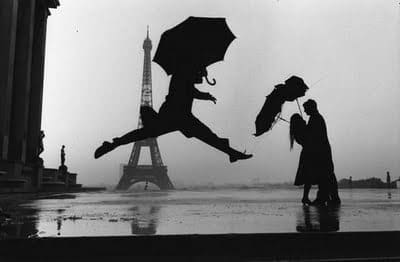 Elliott Erwitt, Paris, France (umbrella jump), 1989