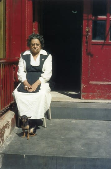 Helen Levitt, Untitled, New York (Woman in red doorway with dog), 1974
