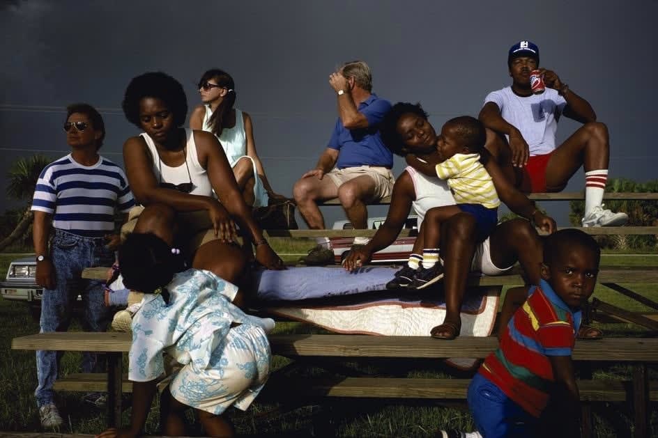 Alex Webb, Plant City (black/white families on picnic table), 1989