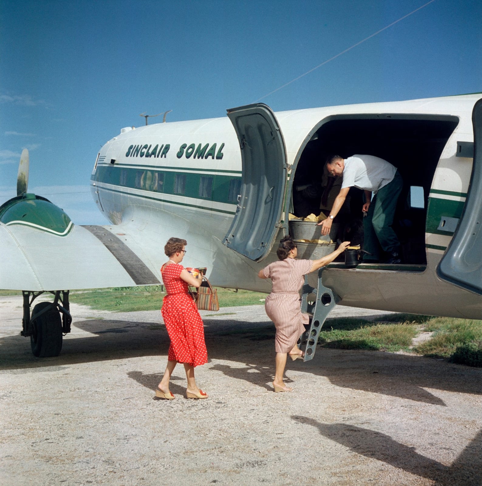 Todd Webb, Somalia Airplane Red Dress, Sinclair Somal, 1958