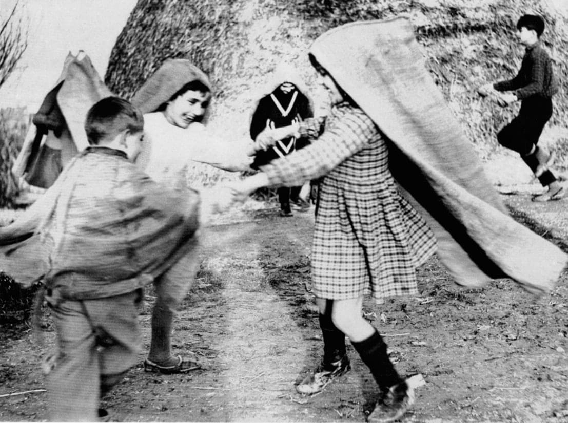 Mario Giacomelli, La Buona Terra (children dancing with burlap bags), 1964-65