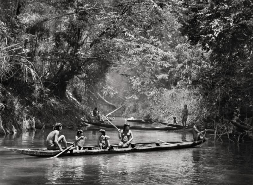 Sebastião Salgado, Pirakumã Kamayurá bringing fish for women’s festival, Yamurikumã, Xingu Indigenous Territory, 2005