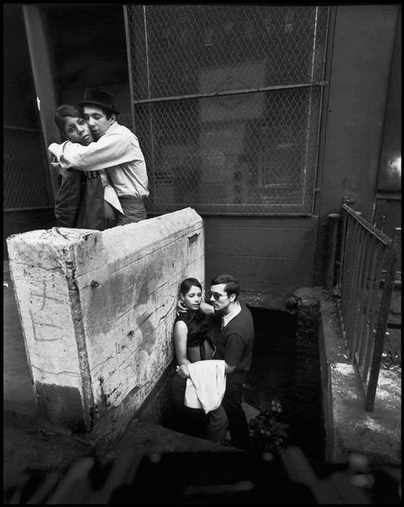 Bruce Davidson, East 100th Street (teenage couples on stairwell and street), 1966-1968
