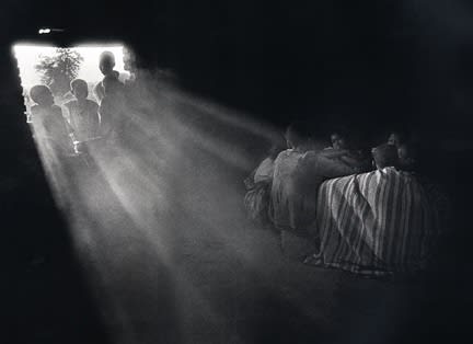 Sebastião Salgado, Southern Sudan (boys hiding, sunlight streaming), 1993