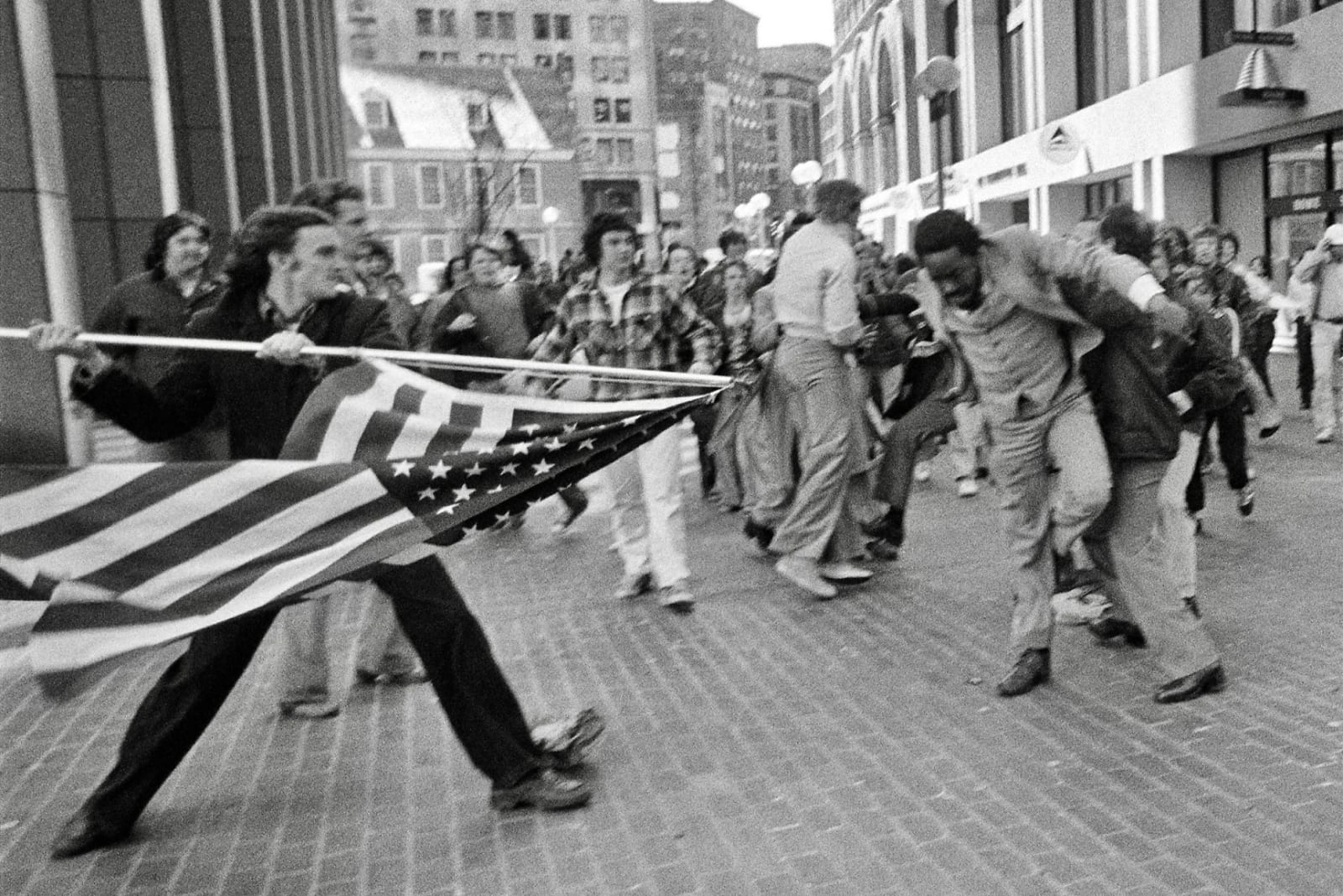 Stanley Forman, The Soiling of Old Glory; Desegregation Busing Protests (Joseph Rakes and Ted Landsmark), Boston, MA, April 5, 1976