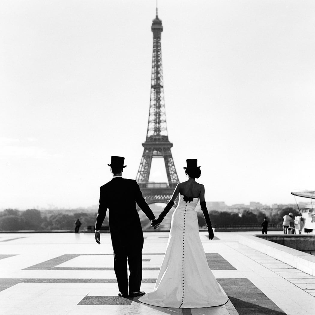 Rodney Smith, Wessel and Mira holding hands in front of the Eiffel Tower, Paris, France