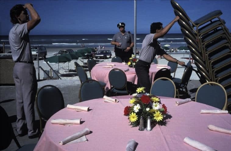 Alex Webb, Daytona Beach, Florida (setting tables on beachfront), 1990