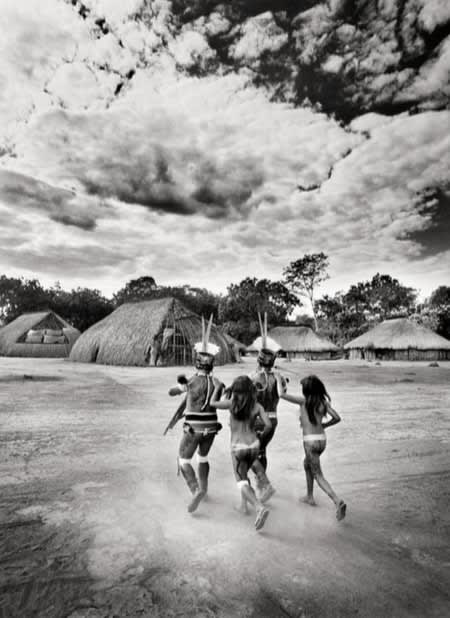 Sebastião Salgado, 86, Kuikuro warriors leading girls, Kuikuro village, Xingu Indigenous Territory, 2005