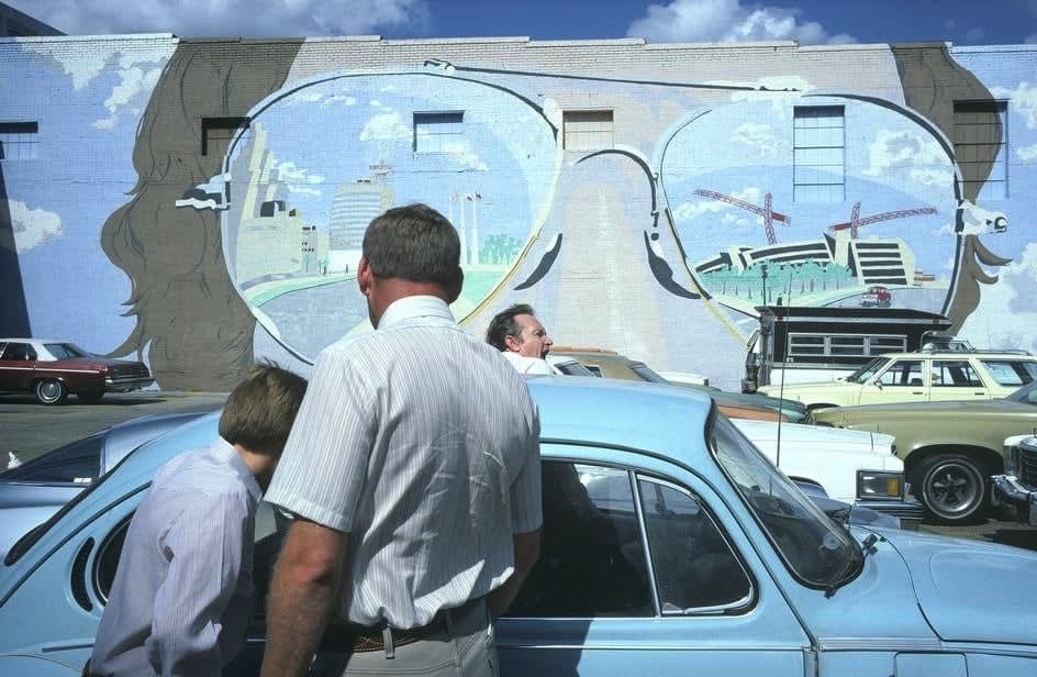 Alex Webb, Dallas, Texas (two men with light blue car), 1981