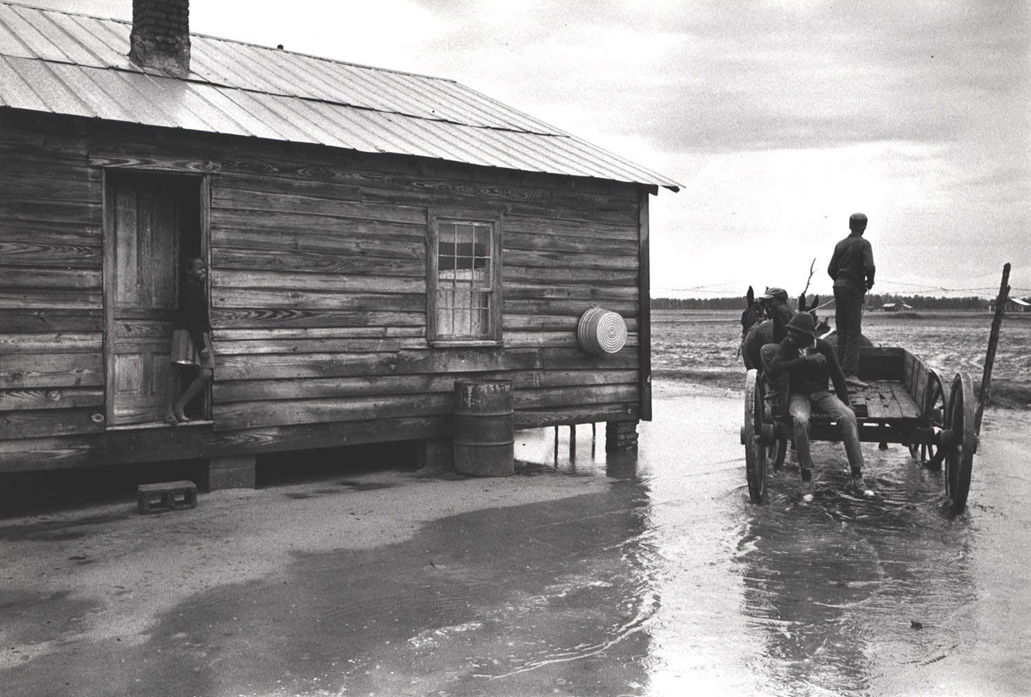 Constantine Manos, Untitled, Sharecroppers, South Carolina (puddle, house, horse drawn wagon), 1965