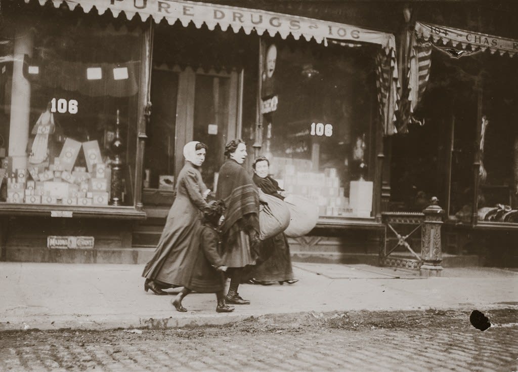 Lewis Wickes Hine, Woman and Girl Carrying Finished Corset Covers, Wooster Street, New York City, February, 1912
