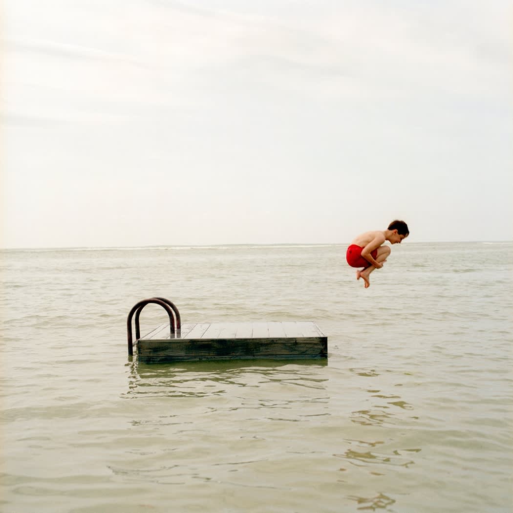 Rodney Smith, Boy jumping off dock, San Juan, Puerto Rico