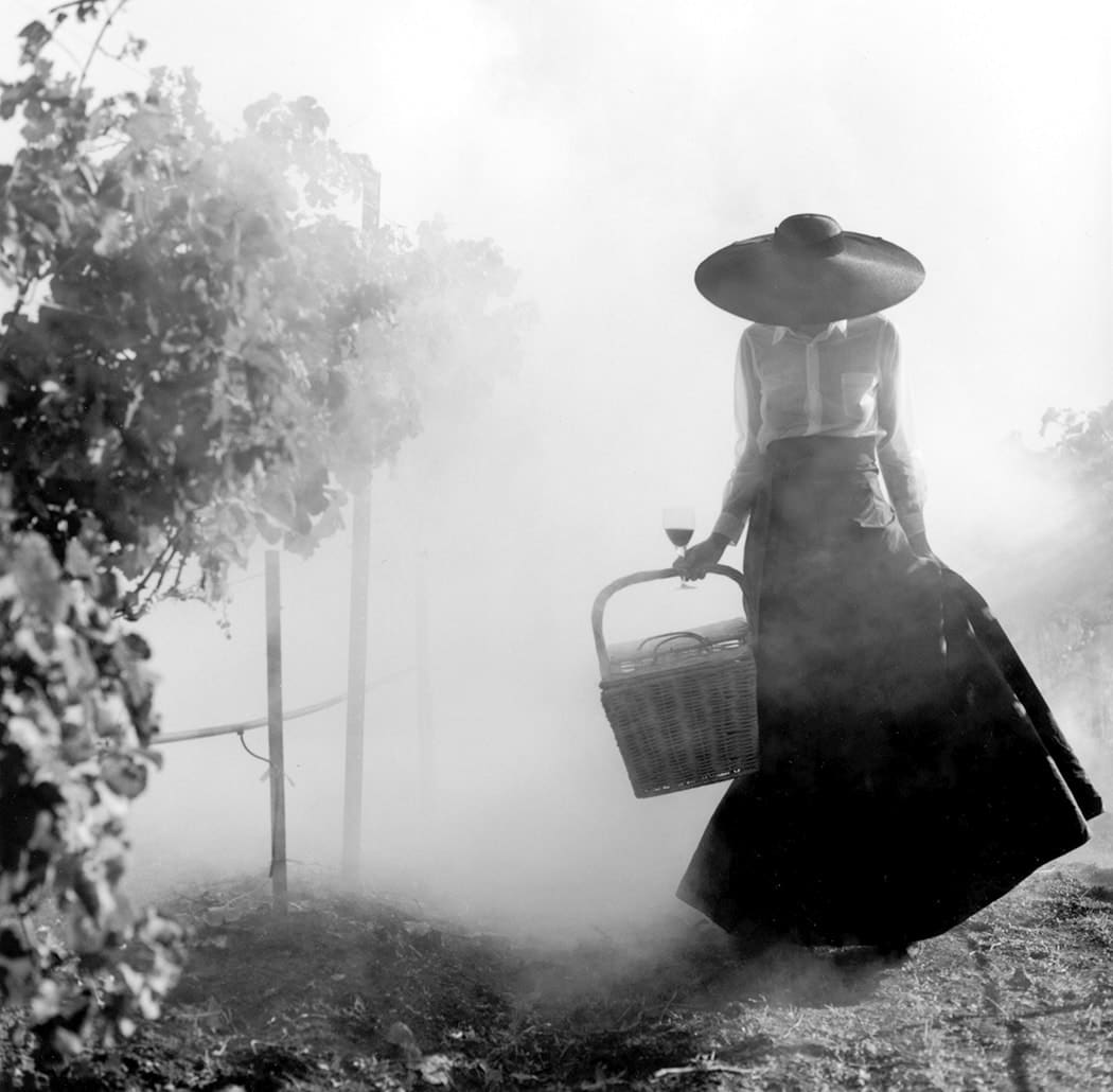 Rodney Smith, Woman Holding Up Dress Walking Through Vineyard, Napa Valley
