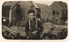Lewis Wickes Hine, Richard Mills, 8 years old, showing a severely cut finger. Is a cutter in Eastport, Maine canneries,...