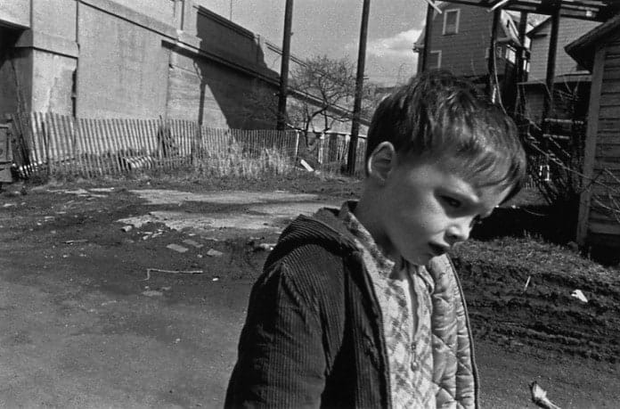 Mark Cohen, Boy in Landscape with Bridge, 1973