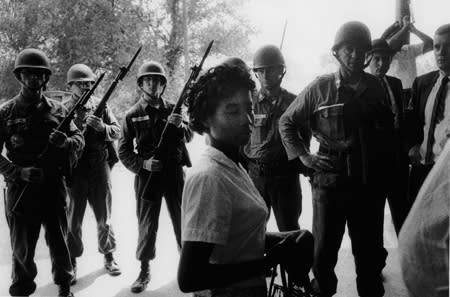 Bruce Davidson, Untitled [girl encircled by soldiers], Alabama, A Time of Change, 1961