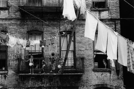 Bruce Davidson, Untitled [kids on fire-escape, laundry], Harlem, A Time of Change, 1962