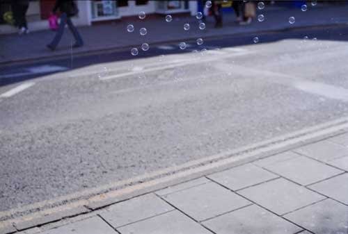 Rinko Kawauchi, Untitled, [bubbles on street]From the series "Murmuration", 2010