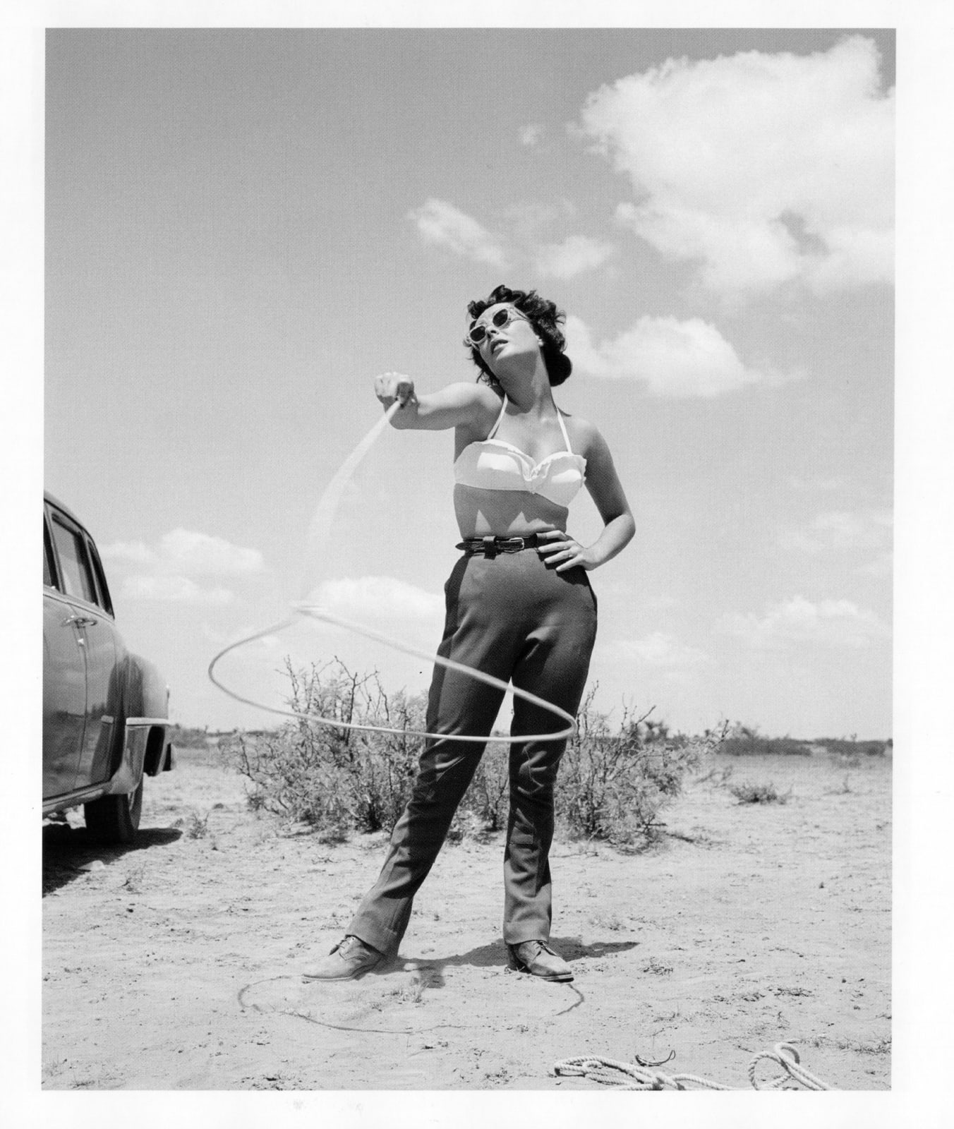 Frank Worth, Elizabeth Taylor with Lasso on Set of “Giant”, 1955