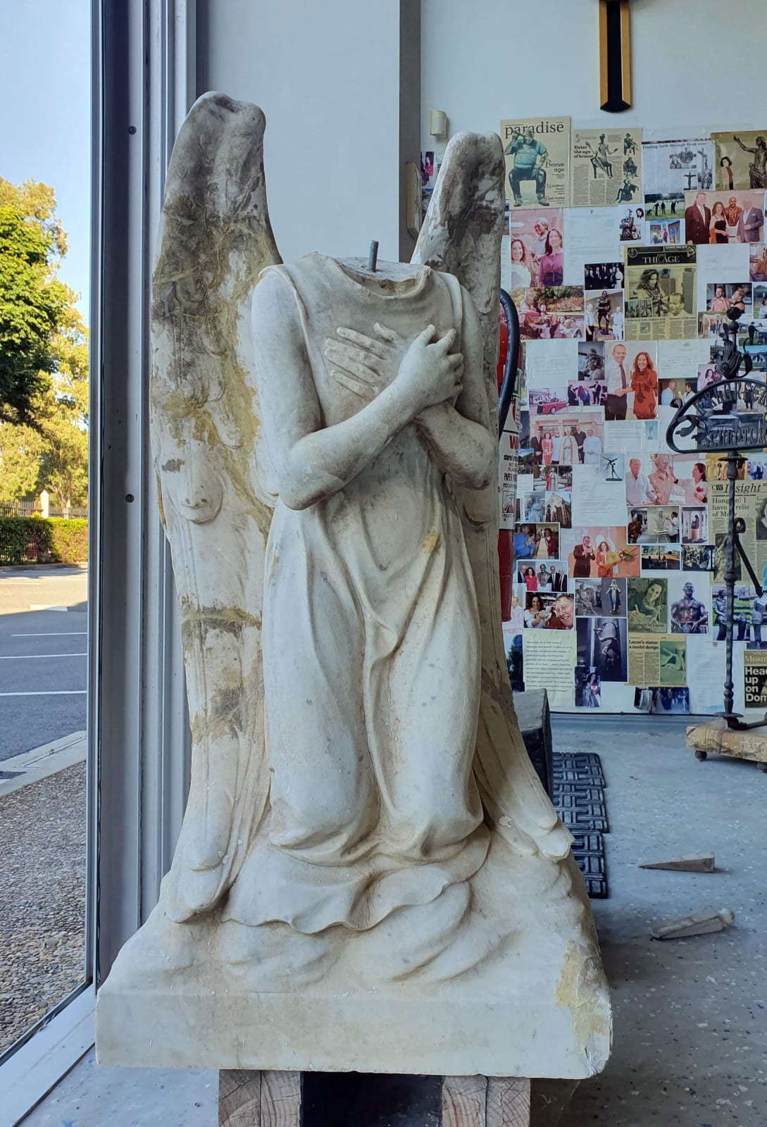 The decapitated marble angel and damage to wings