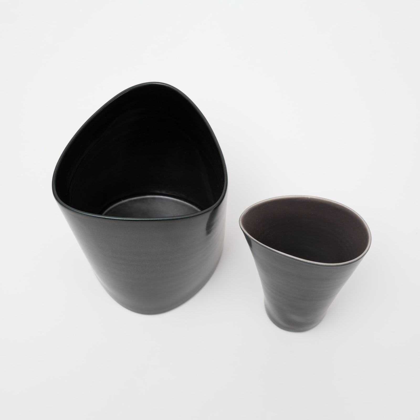 Prue Venables, Tall black triangulated form and black and aubergine jug, 2023