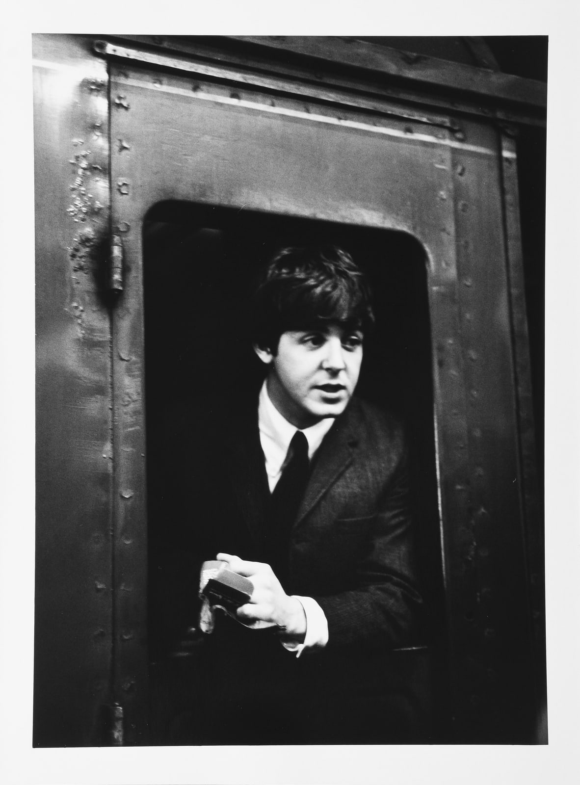 Lord Christopher Thynne, The Beatles, Paul McCartney on a train at Marylebone Station., 1964