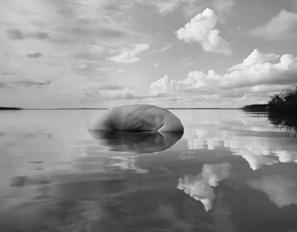 Arno Rafael Minkkinen, Oulujärvi Afternoon, Paltaniemi, Finland (floating torso and clouds) , 2009