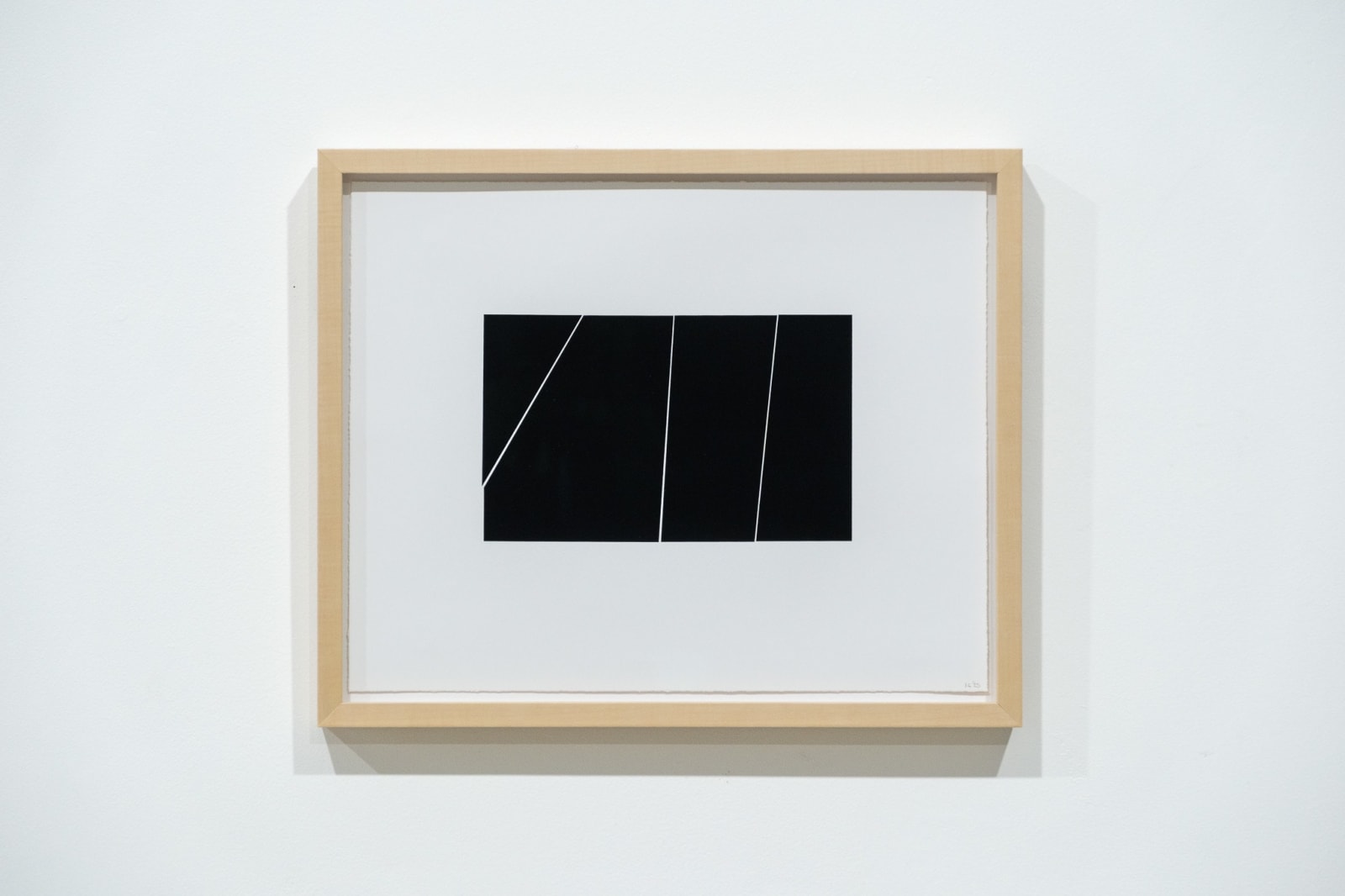 A framed black and white abstract screen print by Ian Gouldstone. A black rectangle is divided into multiple sections by thin white lines.