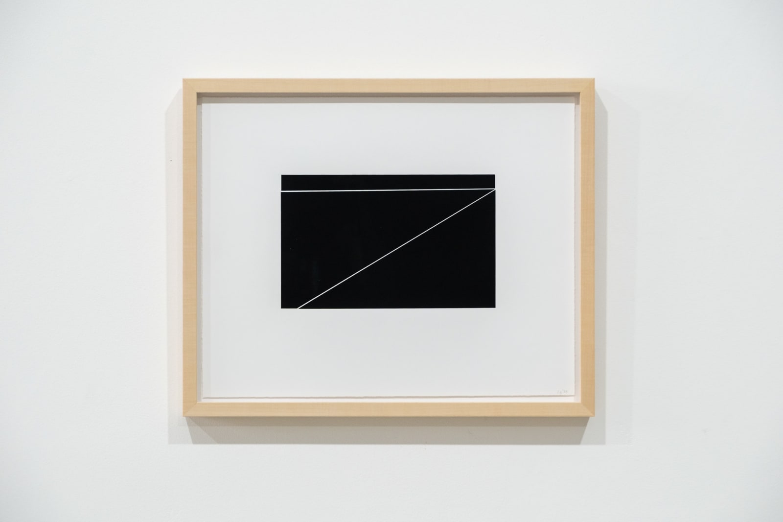 A framed black and white abstract screen print by Ian Gouldstone. A black rectangle is divided into multiple sections by thin white lines.