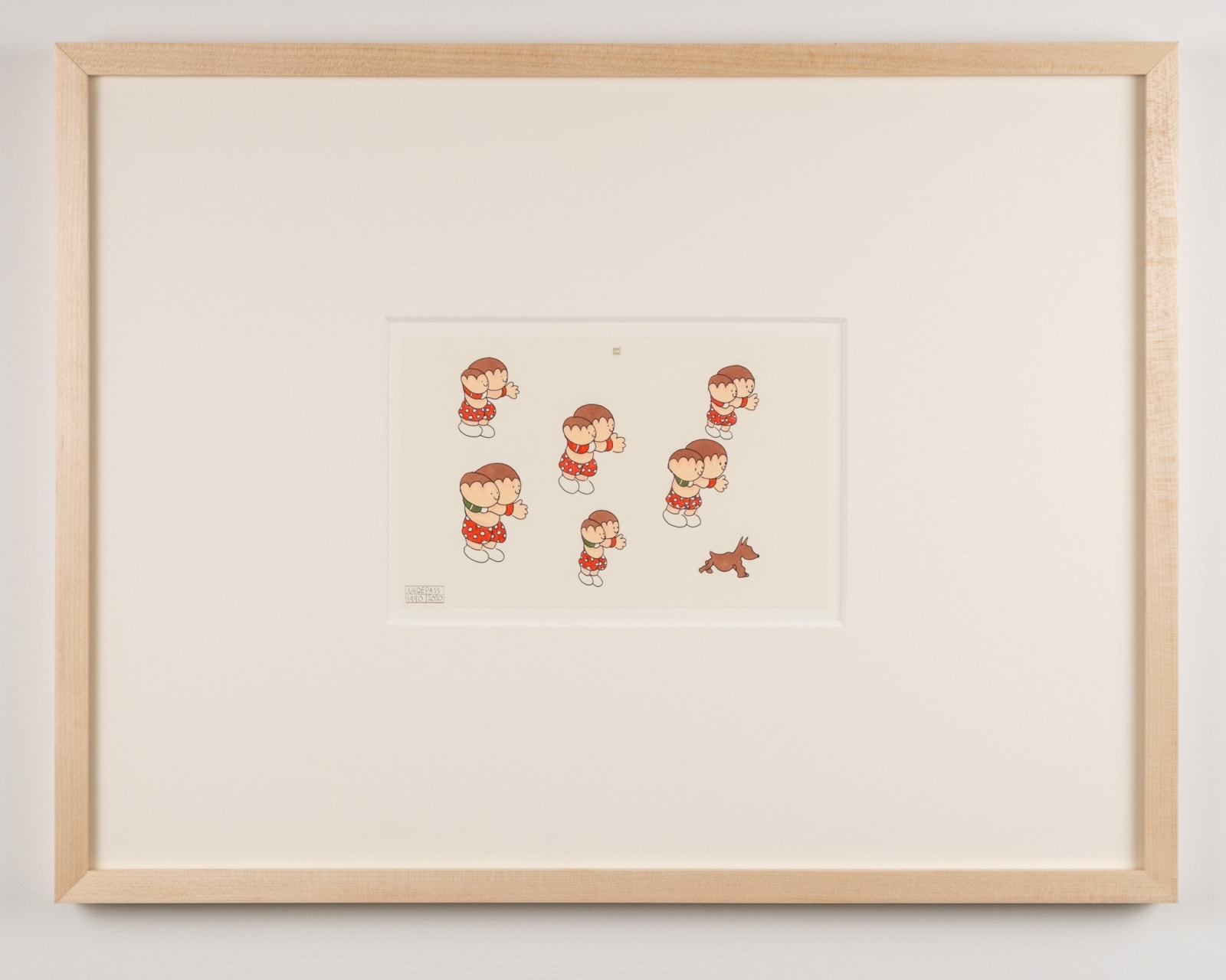 A small framed notebook drawing by NH DePass. The drawing is set into a large white mat. The drawing shows 6 pairs of cartoon people all with short brown hair. All wear red clothing with white polka dots. They appear to be chasing a small brown dog at the bottom right corner of the drawing.