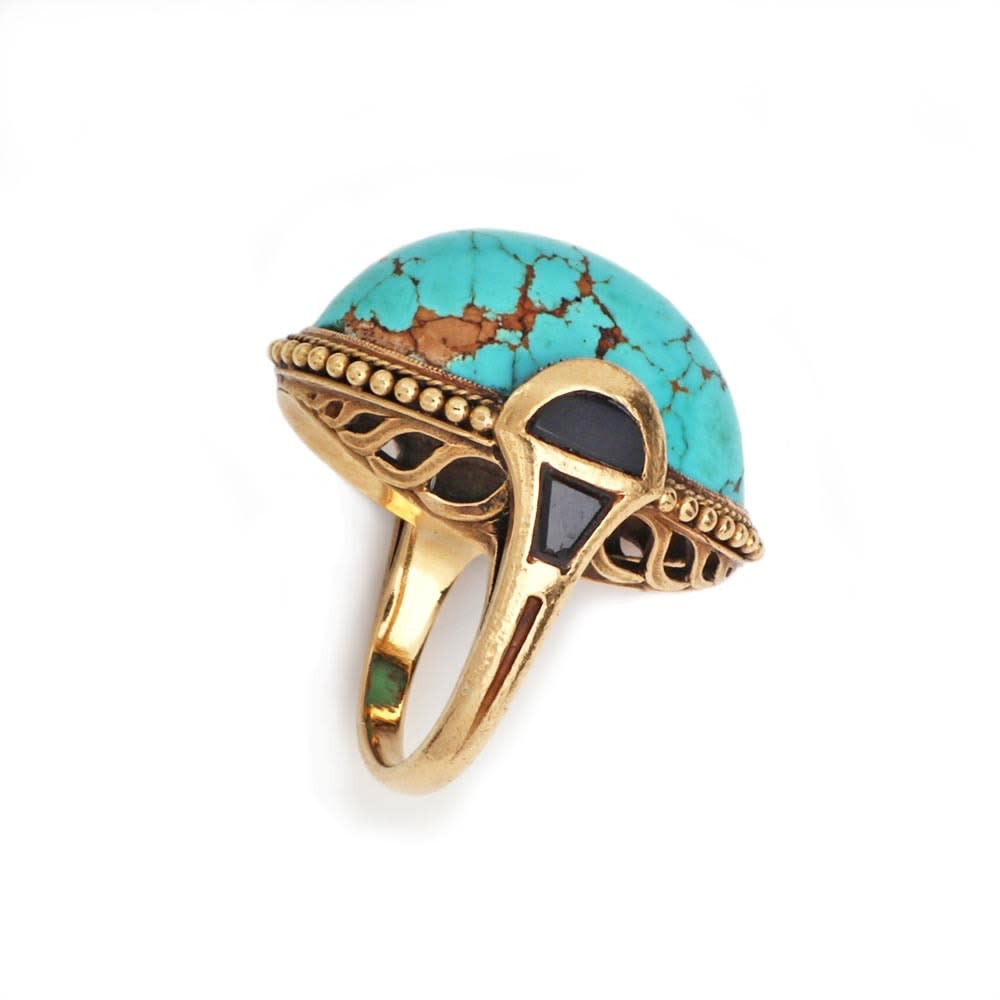 An Egyptian Revival Turquoise, Onyx, and Gold Ring, c. 1910