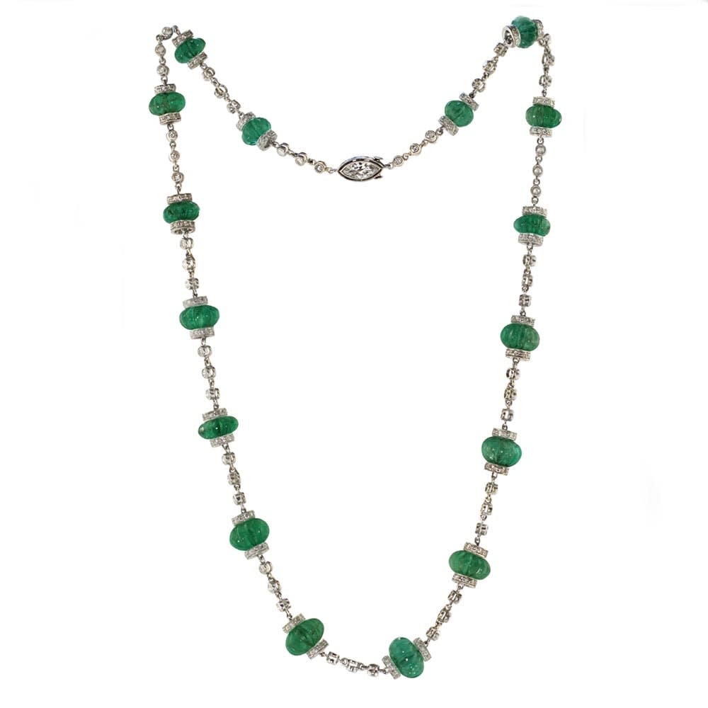 A Platinum, Carved Emerald Bead and Diamond Chain Necklace, c. 1920