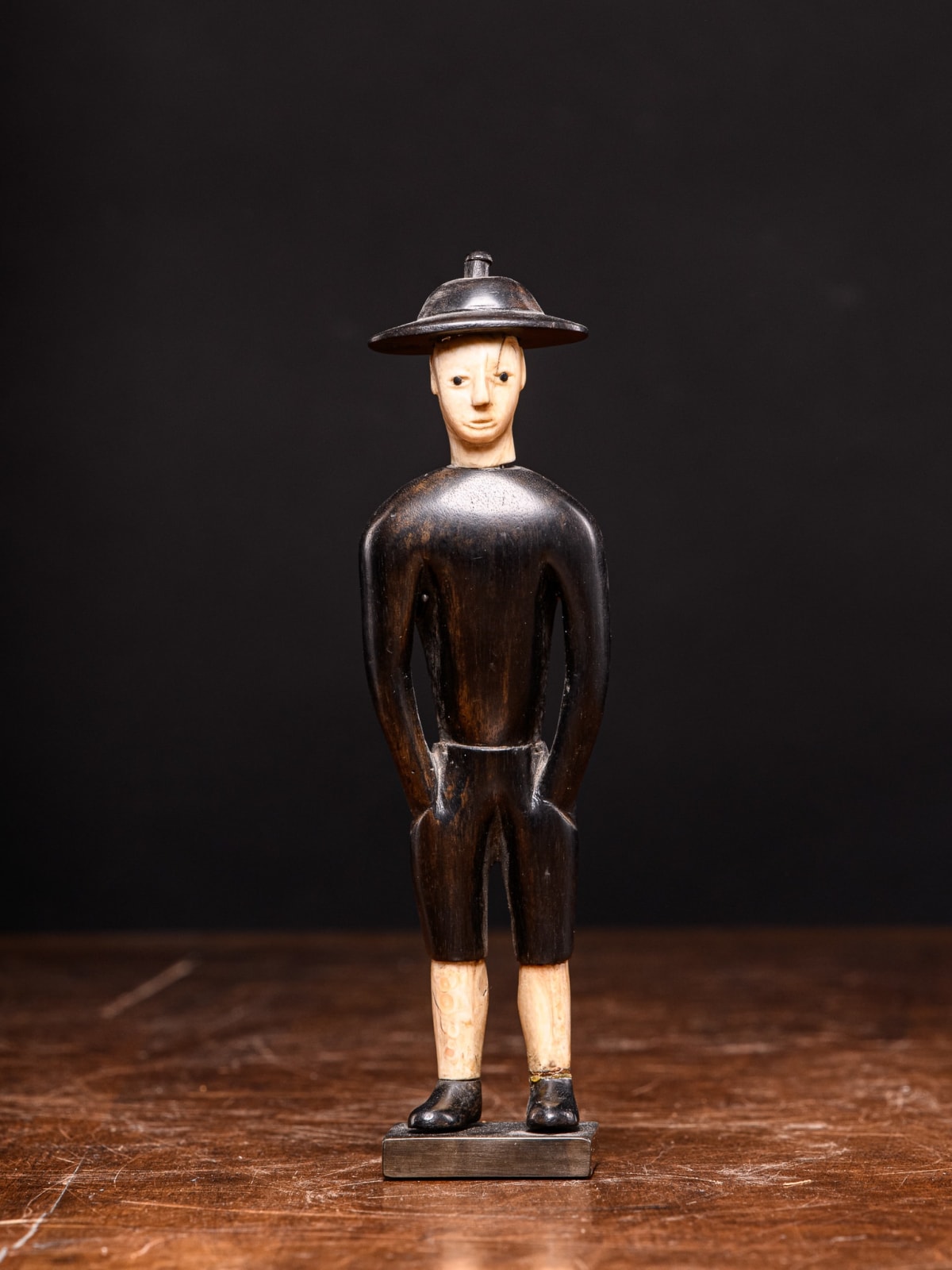Kongo Ebony wood statue depicting Chinese worker waring Ivory hat,DRC., first half 20th C