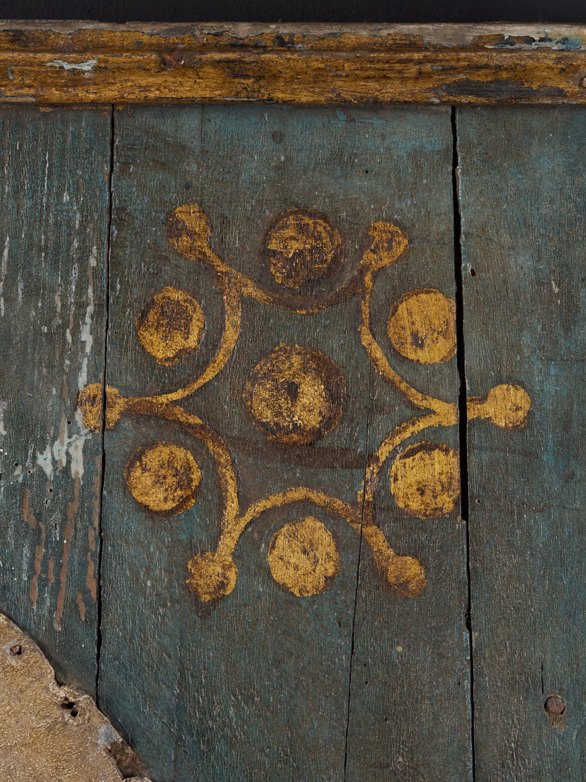 Early 19th C Clock on a Polychromed panel with leftover of the mechanism in the back.Gilded hands fixed on a tin sheet., first half 20th C