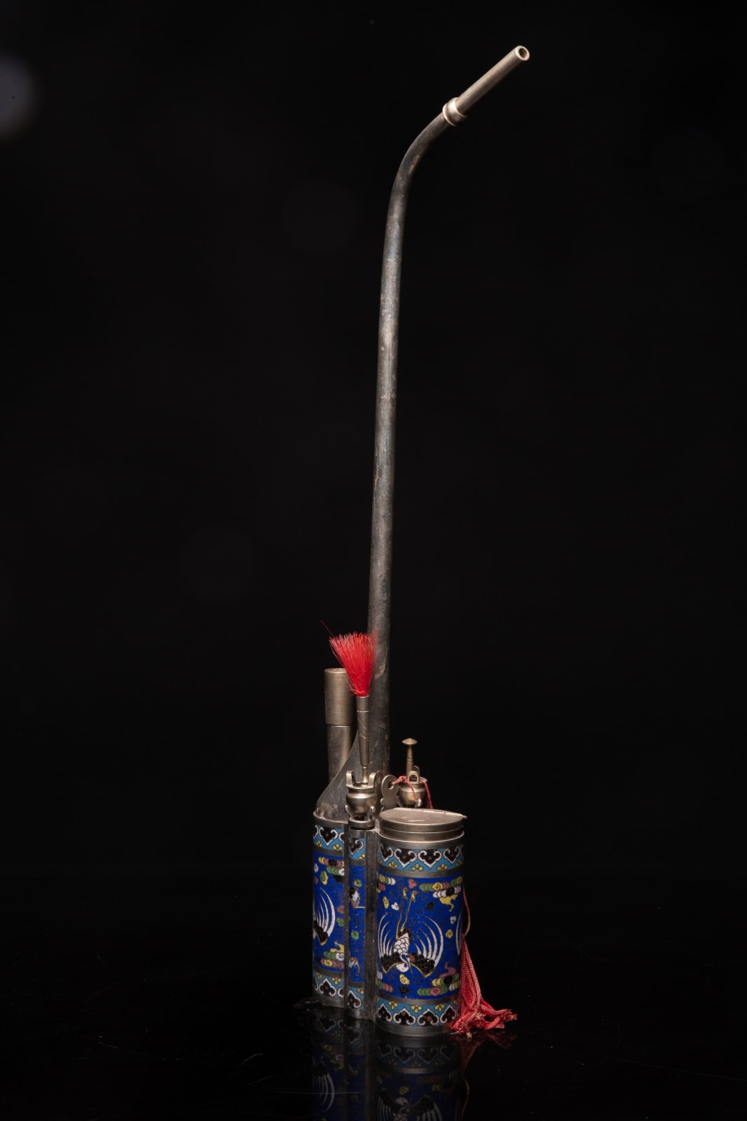 Nineteenth Century Chinese Water Pipe in Paktong (= an Alloy of Zinc, Copper and Nickel). The Base - elaborated in Enamel Cloisonné - is decorated with a Phoenix on an Ultramarine Blue Background. The Accessory Holders have the Form of Incence Burners., 19th Century
