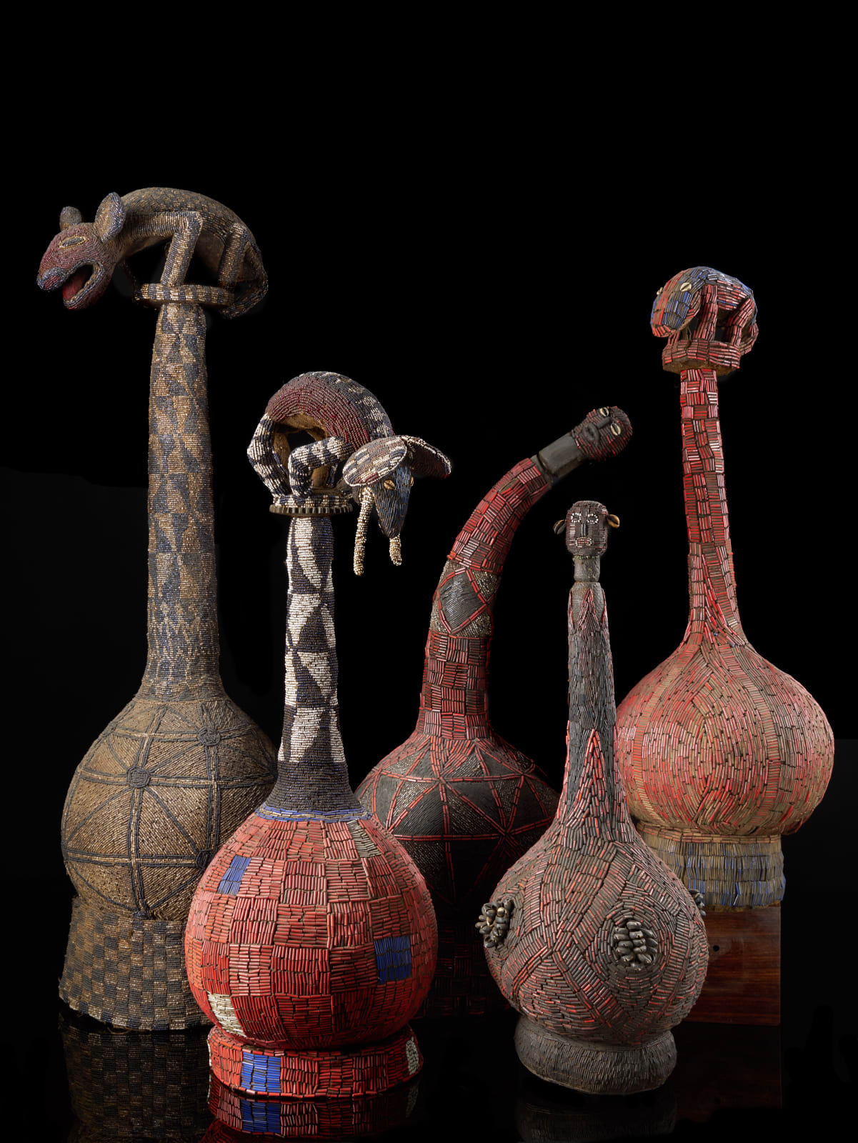 Selection of five Decoratif Ceremonial Beaded Palm Wine Vessel topped with Animal & human Figures, First half 20th C