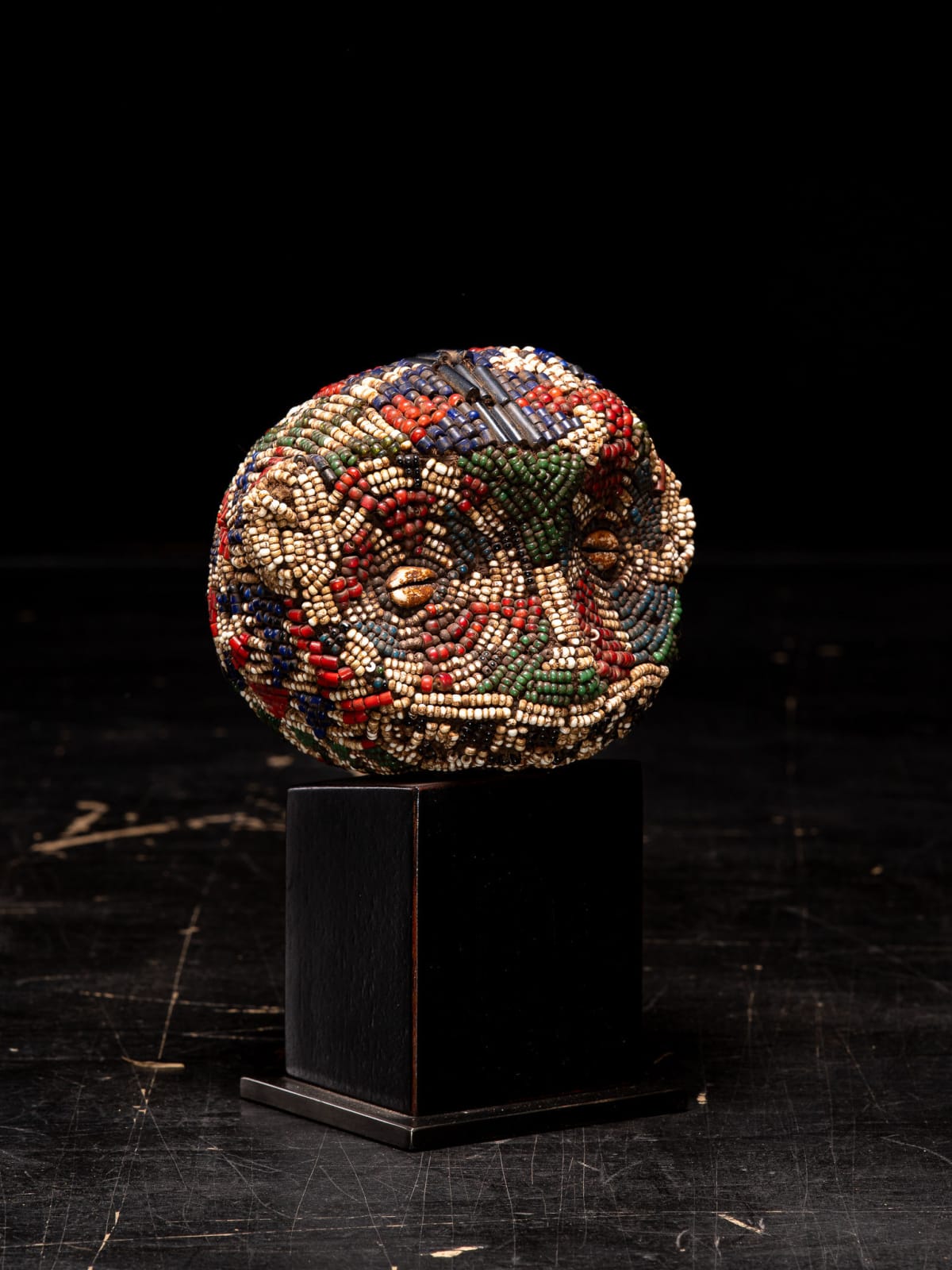 Bamileke Old Anthropomorphic Trophy Head embroidered with Murano White heart Glass Beads, Cameroon, 1st half 20th Century