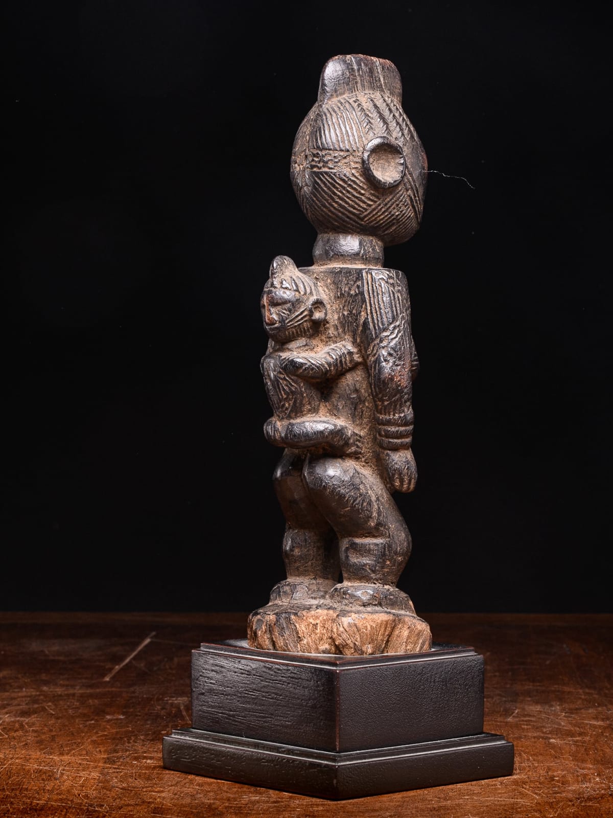 Igala scarified Maternity with infant on her back, Nigeria, 1st half 20th Century