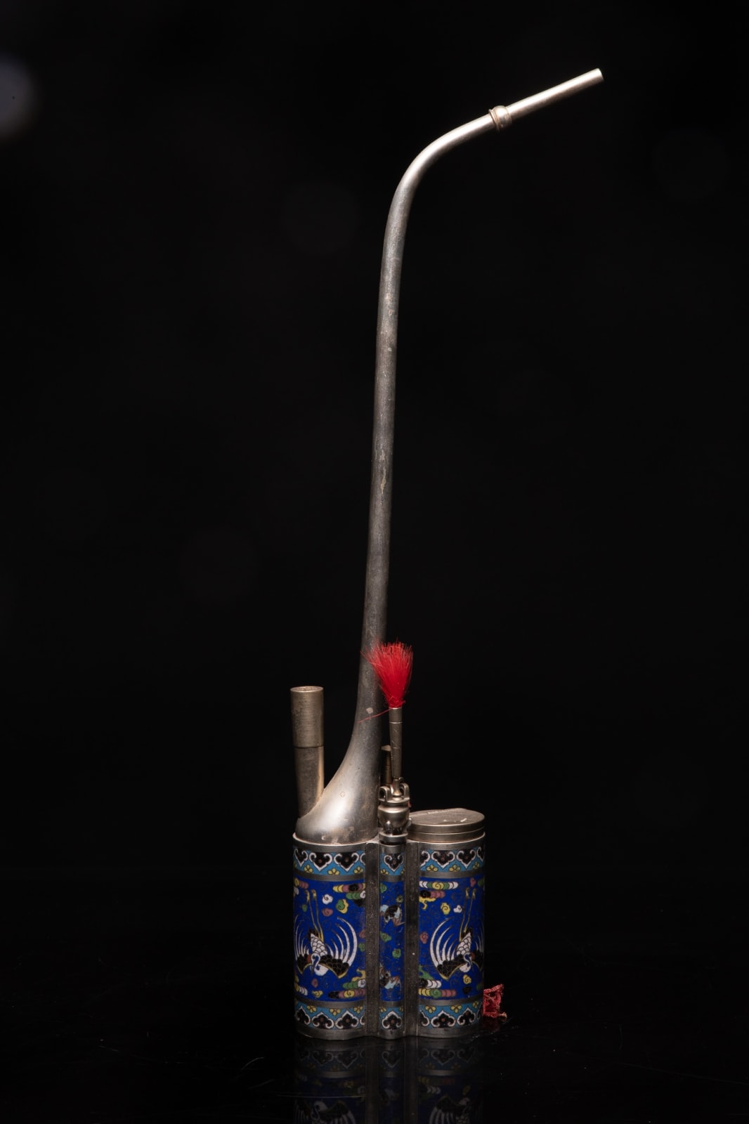 Nineteenth Century Chinese Water Pipe in Paktong (= an Alloy of Zinc, Copper and Nickel). The Base - elaborated in Enamel Cloisonné - is decorated with a Phoenix on an Ultramarine Blue Background. The Accessory Holders have the Form of Incence Burners., 19th Century